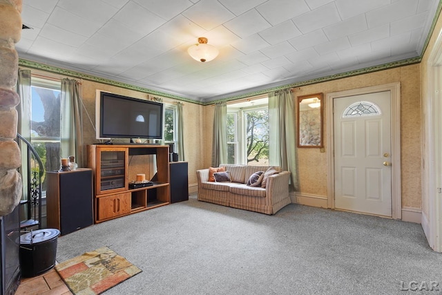 4460 Munger Rd, Tipton, MI 49287 - living area with wallpapered walls, healthy amount of natural light, carpet flooring, and ornamental molding