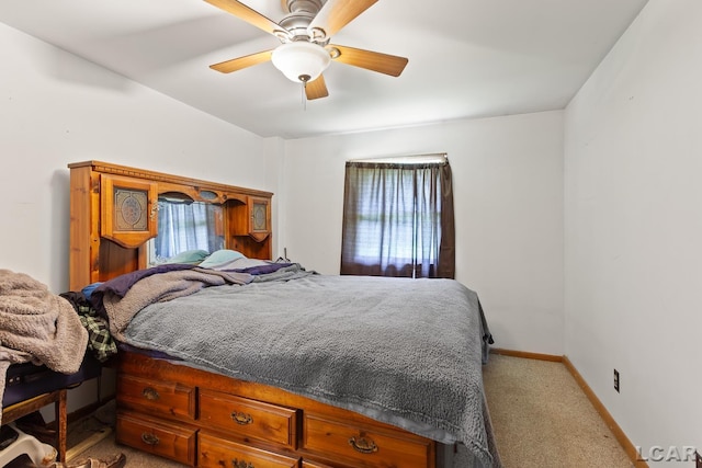 4460 Munger Rd, Tipton, MI 49287 - bedroom featuring light carpet, baseboards, and ceiling fan