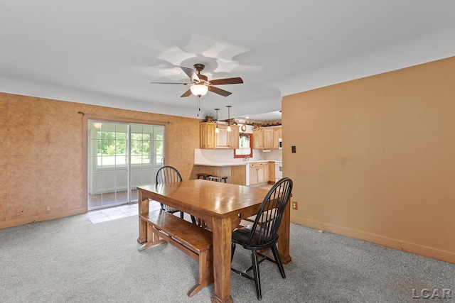 4460 Munger Rd, Tipton, MI 49287 - dining room with a ceiling fan, baseboards, and light colored carpet