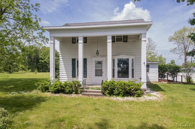 4460 Munger Rd, Tipton, MI 49287 - greek revival house featuring covered porch and a front yard