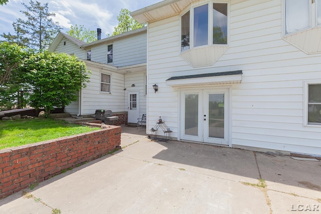4460 Munger Rd, Tipton, MI 49287 - rear view of property with a patio and french doors