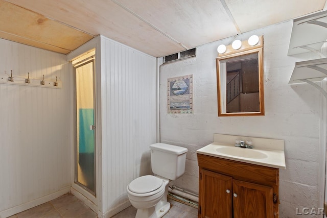 4460 Munger Rd, Tipton, MI 49287 - bathroom featuring vanity, toilet, an enclosed shower, and tile patterned flooring
