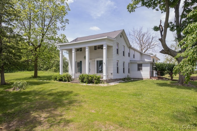 4460 Munger Rd, Tipton, MI 49287 - greek revival house with a front yard and covered porch