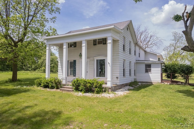 4460 Munger Rd, Tipton, MI 49287 - view of front of property featuring a front lawn and a porch