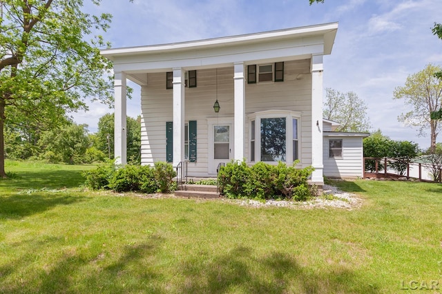 4460 Munger Rd, Tipton, MI 49287 - greek revival inspired property with a front yard and a porch