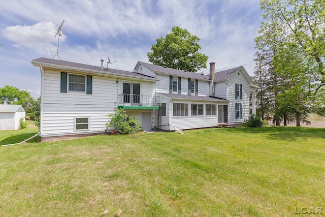 4460 Munger Rd, Tipton, MI 49287 - back of house featuring a yard, a chimney, and an attached garage
