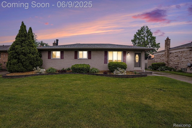 16362 Glenfield Dr, Macomb, MI 48044 - single story home featuring brick siding, a yard, and a chimney