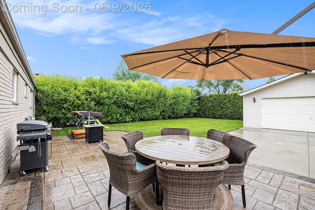 16362 Glenfield Dr, Macomb, MI 48044 - view of patio / terrace featuring outdoor dining area, a garage, an outbuilding, and grilling area