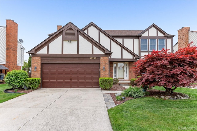 45785 Bryn Mawr Rd, Canton, MI 48187 - tudor home with stucco siding, brick siding, and a front lawn