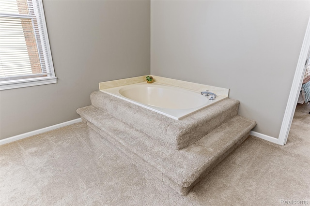 45785 Bryn Mawr Rd, Canton, MI 48187 - bathroom featuring a garden tub, baseboards, and carpet