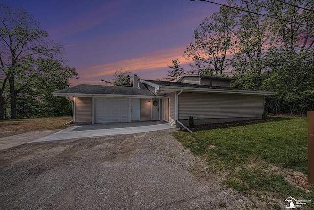 2930 Spielman Rd, Adrian, MI 49221 - view of front of property with asphalt driveway, an attached garage, and a lawn