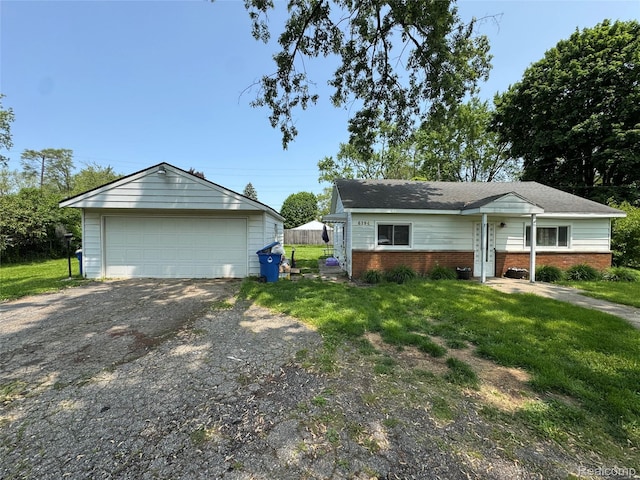 6194 Wilson Dr, Waterford, MI 48329 - view of front of home featuring a detached garage, an outdoor structure, a front lawn, and brick siding