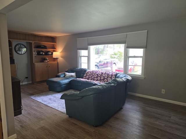 510 E Lewis St, Whitehall, MI 49461 - living area with dark wood-style flooring and baseboards