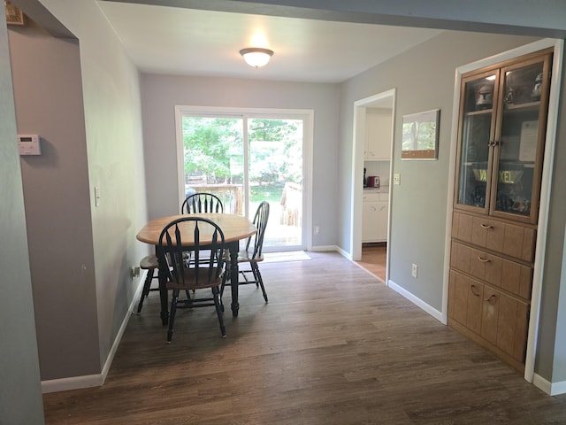 510 E Lewis St, Whitehall, MI 49461 - dining space with dark wood-type flooring and baseboards