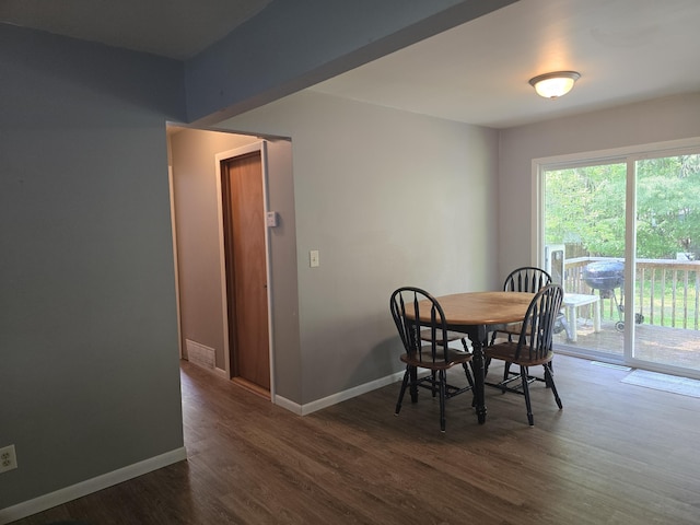 510 E Lewis St, Whitehall, MI 49461 - dining space featuring dark wood-style flooring and baseboards
