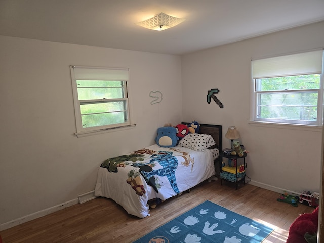 510 E Lewis St, Whitehall, MI 49461 - bedroom featuring wood finished floors and baseboards