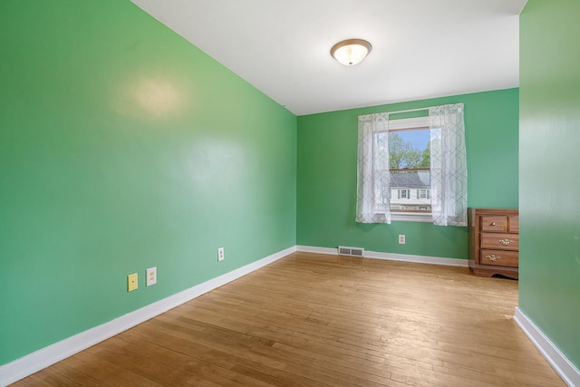 528 Glendale Blvd, Parchment, MI 49004 - spare room with wood-type flooring and baseboards
