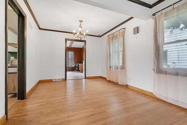 528 Glendale Blvd, Parchment, MI 49004 - empty room featuring ornamental molding, healthy amount of natural light, light wood-type flooring, a chandelier, and baseboards