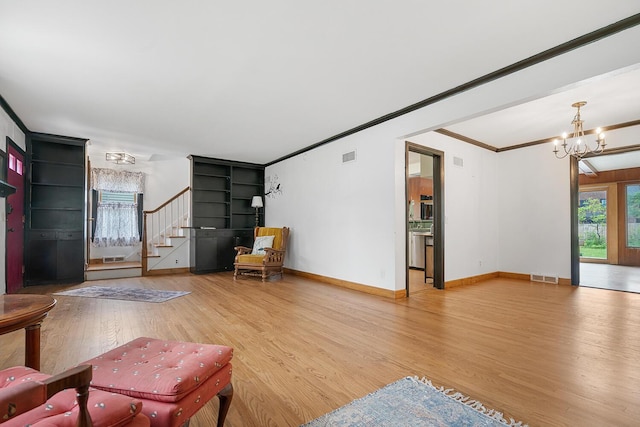 528 Glendale Blvd, Parchment, MI 49004 - living area with wood finished floors, ornamental molding, a chandelier, stairs, and baseboards