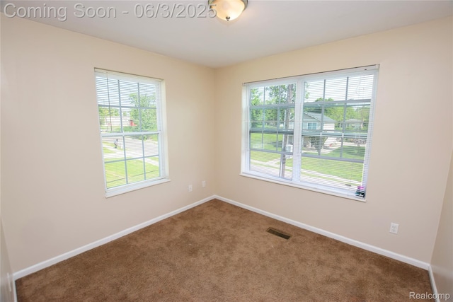 218 E Wood St, Flint, MI 48503 - unfurnished room featuring carpet flooring and baseboards
