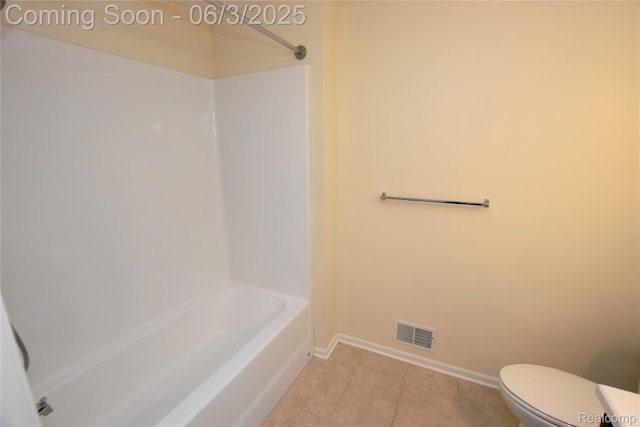 218 E Wood St, Flint, MI 48503 - bathroom with tile patterned floors, toilet, baseboards, and washtub / shower combination