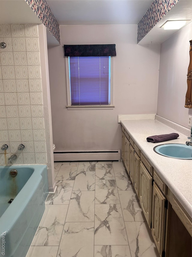 205 Sterling Dr, Lapeer, MI 48446 - full bathroom featuring a baseboard radiator, marble finish floors, vanity, a tub, and toilet
