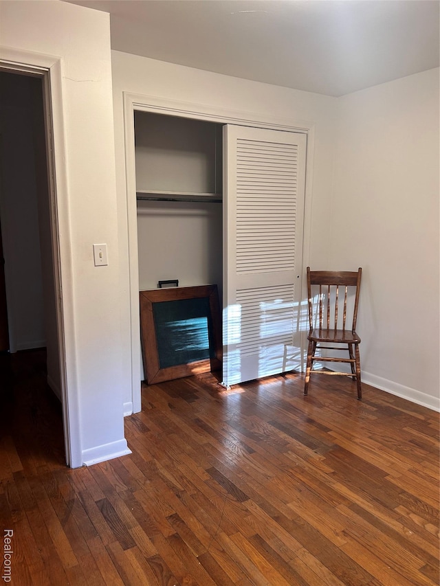 205 Sterling Dr, Lapeer, MI 48446 - unfurnished bedroom featuring hardwood / wood-style floors, a closet, and baseboards