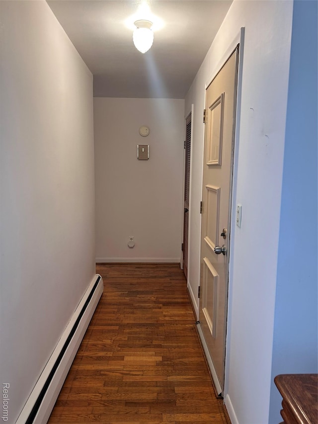 205 Sterling Dr, Lapeer, MI 48446 - corridor featuring a baseboard heating unit, dark wood finished floors, and baseboards
