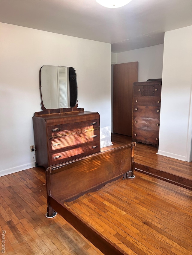 205 Sterling Dr, Lapeer, MI 48446 - bedroom featuring wood-type flooring and baseboards