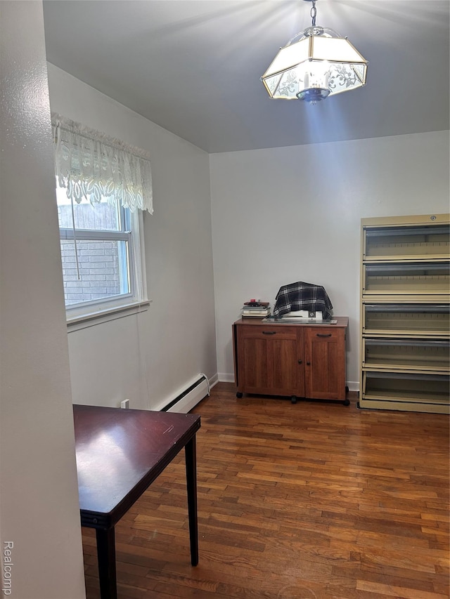 205 Sterling Dr, Lapeer, MI 48446 - office area with a baseboard radiator, dark wood-style flooring, and baseboards