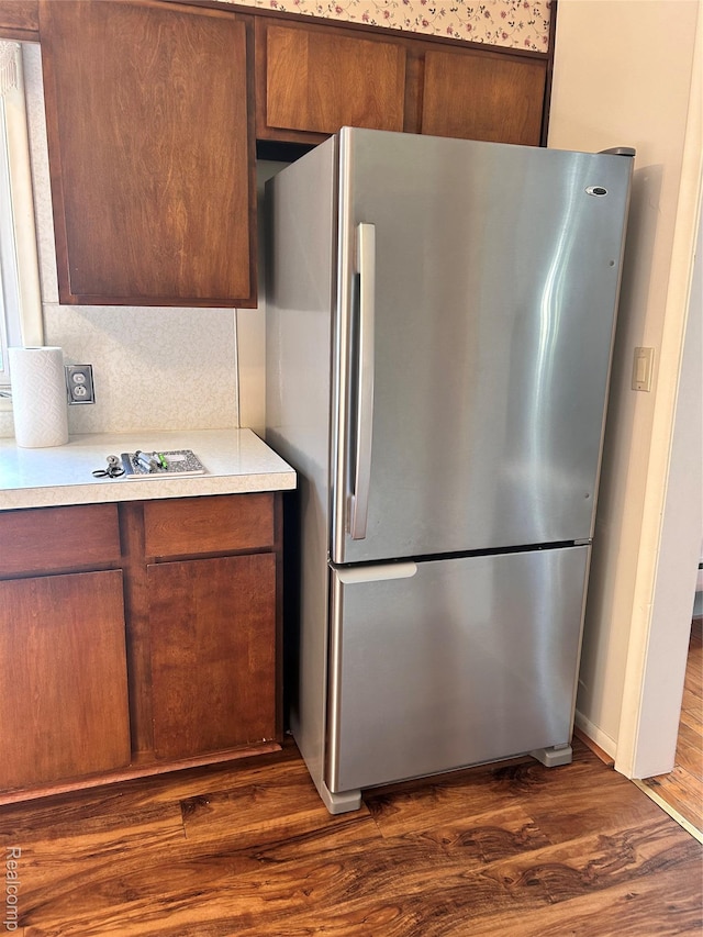 205 Sterling Dr, Lapeer, MI 48446 - kitchen with freestanding refrigerator, dark wood-style flooring, and light countertops