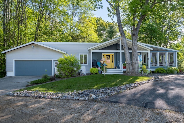 11198 E Royal Rd, Canadian Lakes, MI 49346 - mid-century inspired home with concrete driveway, a garage, and a front lawn