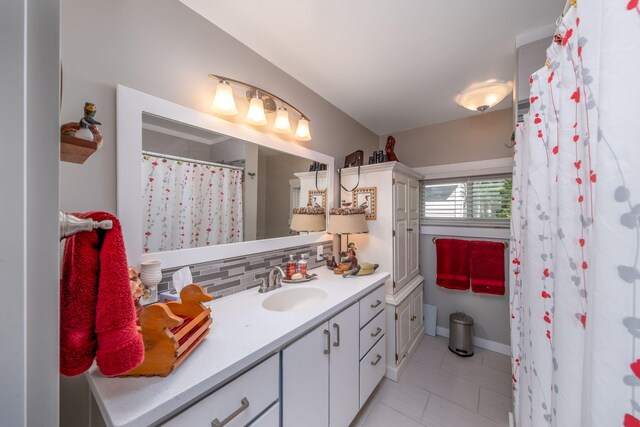 11198 E Royal Rd, Canadian Lakes, MI 49346 - full bath with vanity, tasteful backsplash, tile patterned floors, and a shower with curtain