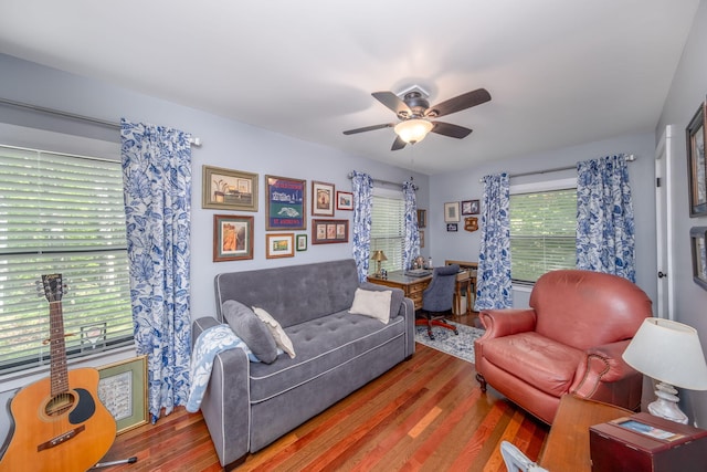 11198 E Royal Rd, Canadian Lakes, MI 49346 - living area featuring wood finished floors and a ceiling fan