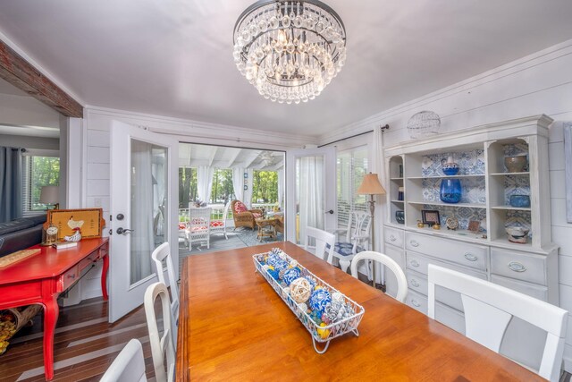 11198 E Royal Rd, Canadian Lakes, MI 49346 - dining room with a chandelier, french doors, ornamental molding, and wood finished floors