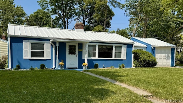 612 Cressfield Ln, Ann Arbor, MI 48103 - view of front of property with a chimney, a front lawn, an attached garage, and metal roof