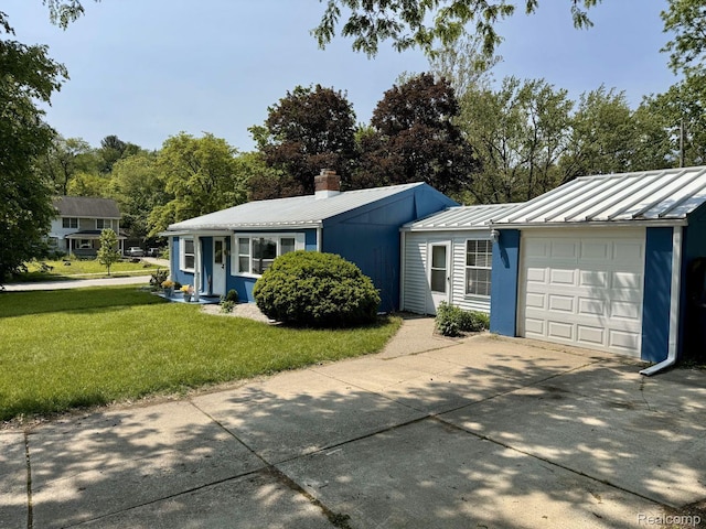 612 Cressfield Ln, Ann Arbor, MI 48103 - ranch-style home featuring a front yard, metal roof, a garage, and driveway