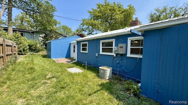 612 Cressfield Ln, Ann Arbor, MI 48103 - view of home's exterior with cooling unit and a chimney