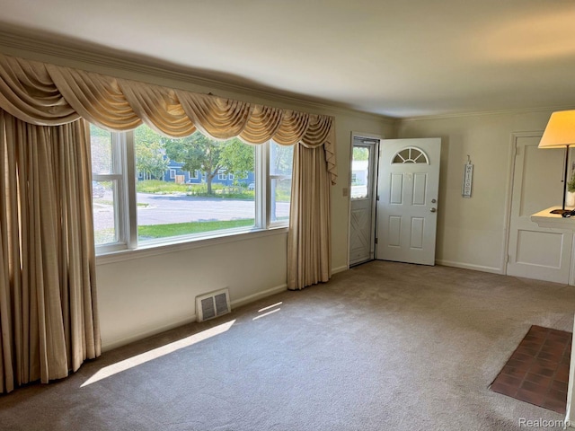 612 Cressfield Ln, Ann Arbor, MI 48103 - entrance foyer featuring carpet floors, baseboards, and crown molding