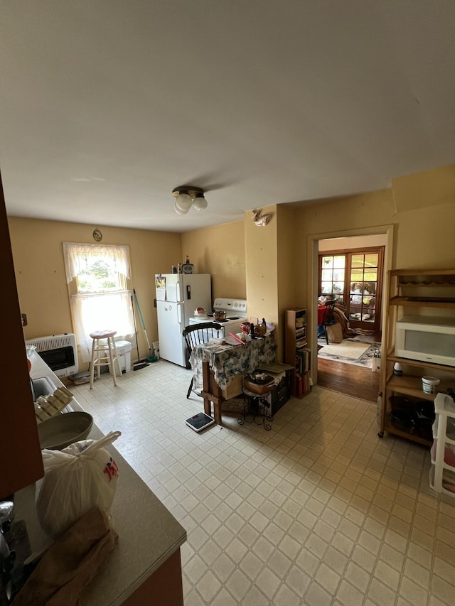 7530 Warren Woods Rd, Three Oaks, MI 49128 - living area featuring plenty of natural light and heating unit