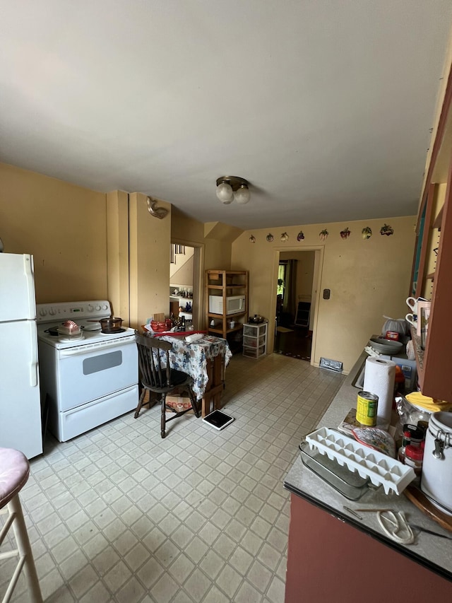 7530 Warren Woods Rd, Three Oaks, MI 49128 - kitchen featuring white appliances