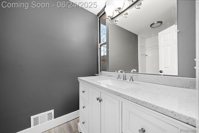 1008 Trevor Pl, Detroit, MI 48207 - bathroom featuring vanity and wood finished floors