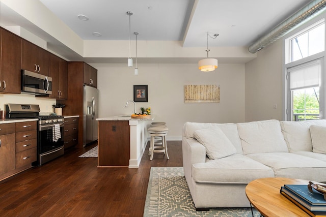 410 N First St Unit 207, Ann Arbor, MI 48103 - living area with dark wood-style floors and baseboards