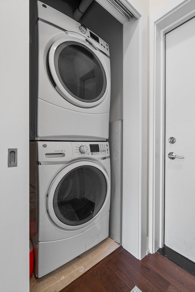 410 N First St Unit 207, Ann Arbor, MI 48103 - laundry area with stacked washer and clothes dryer and wood finished floors