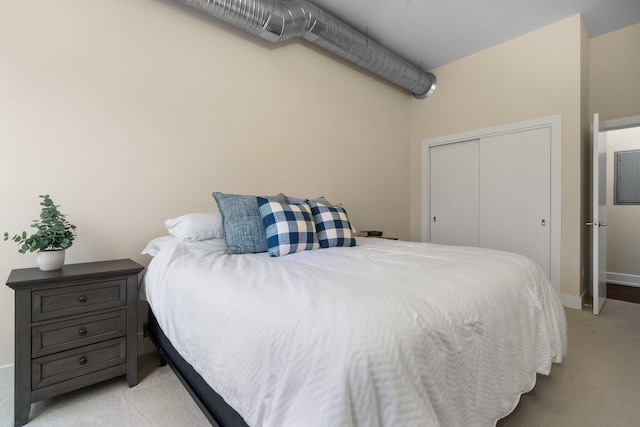 410 N First St Unit 207, Ann Arbor, MI 48103 - bedroom featuring light carpet, a closet, and baseboards