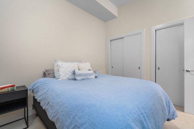 410 N First St Unit 207, Ann Arbor, MI 48103 - bedroom featuring two closets and light colored carpet