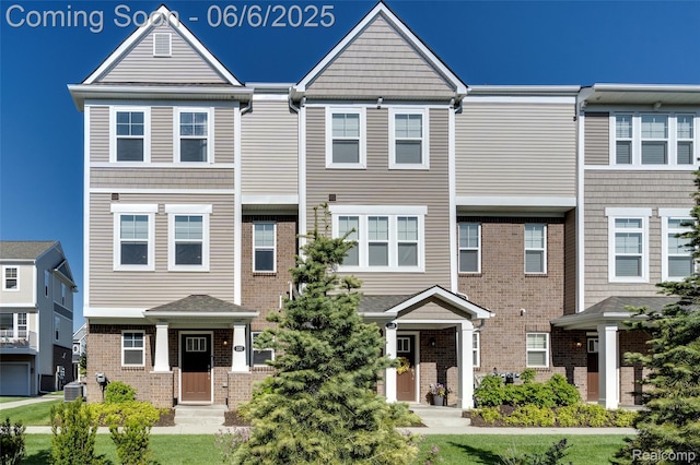 137 Monument Ln, Wixom, MI 48393 - multi unit property featuring brick siding