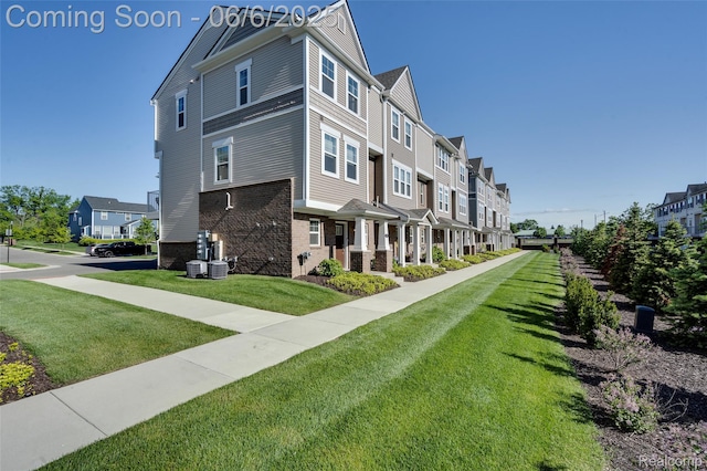 137 Monument Ln, Wixom, MI 48393 - view of building exterior featuring a residential view and central air condition unit