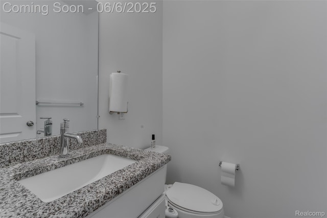 137 Monument Ln, Wixom, MI 48393 - half bathroom featuring vanity and toilet