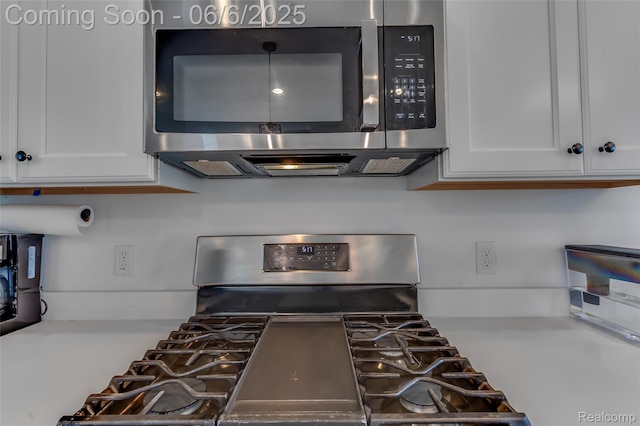 137 Monument Ln, Wixom, MI 48393 - kitchen view of appliances with stainless steel finishes, white cabinets, and light countertops